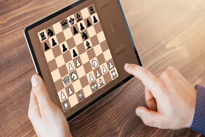 Playing Chess on a tablet.
