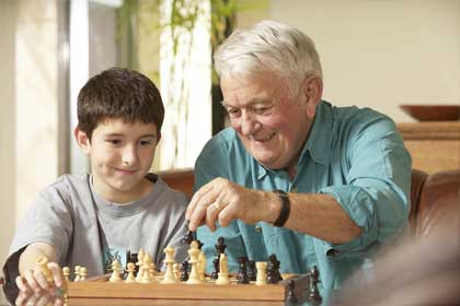 Grandfather and Kid Playing Chess